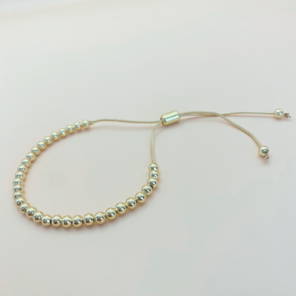 Pulsera esfera 3 mm ajustable chapada en 18K